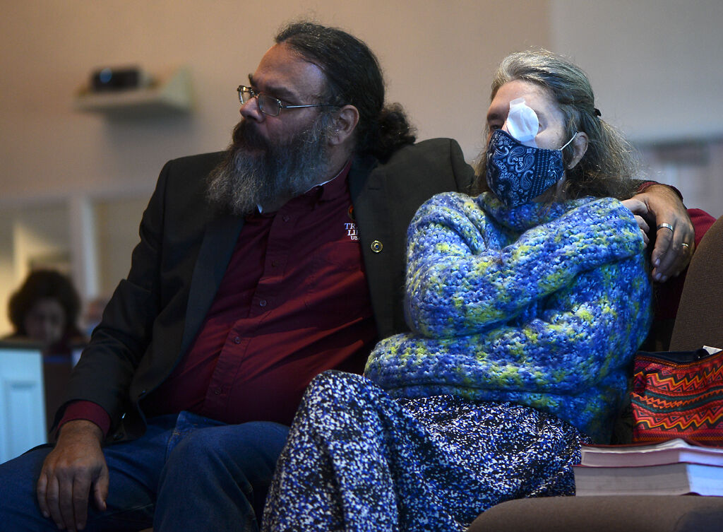 Terry and Amber Gamble watch Eunice Morrow sign along with a church service